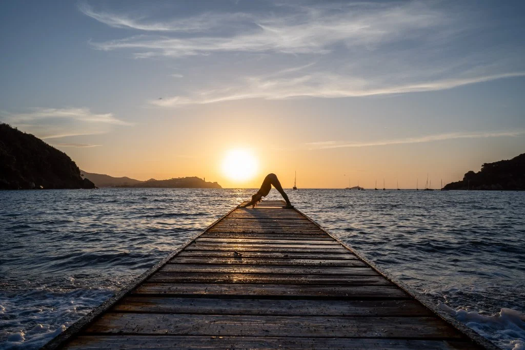 Yoga on the jetty at sunset